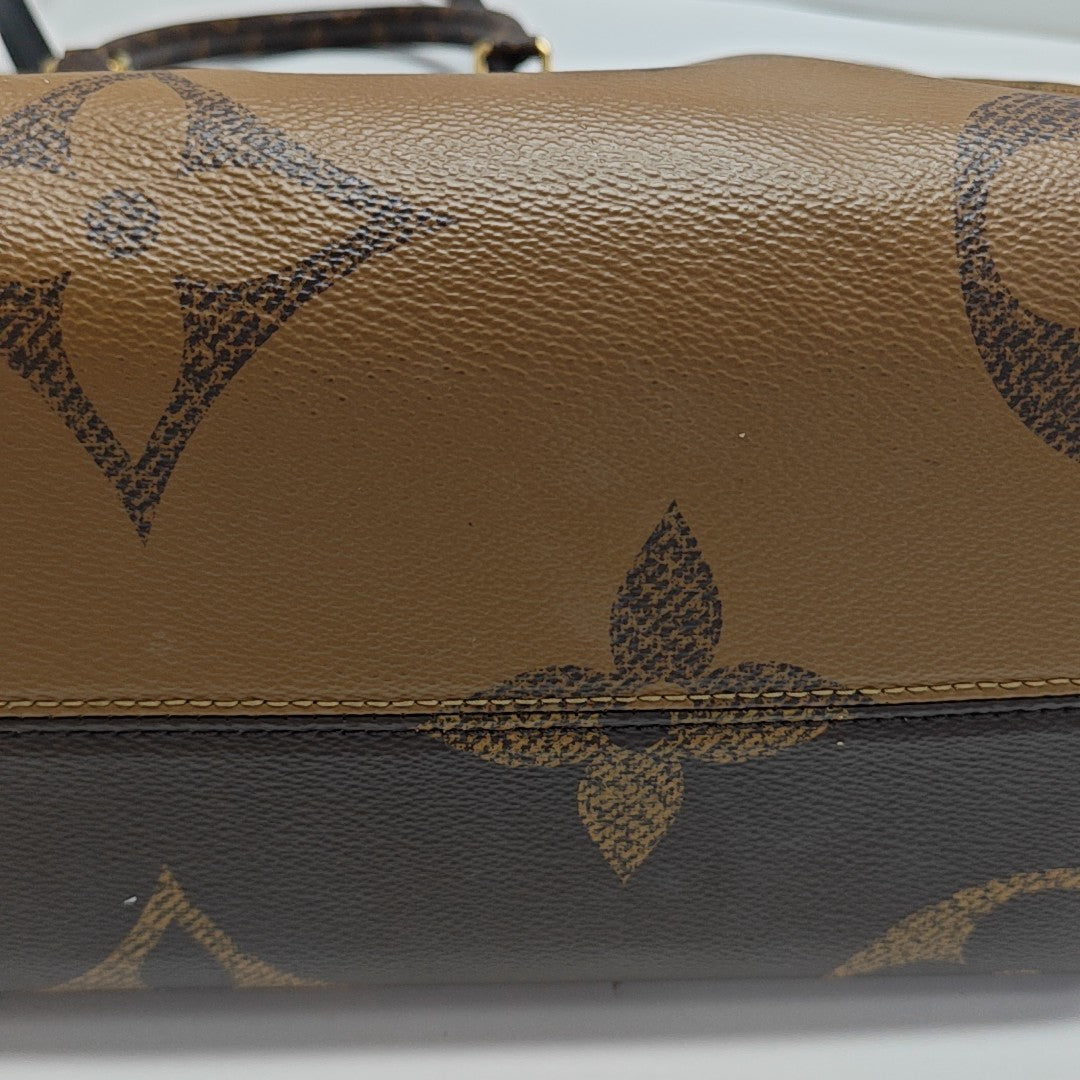 ONTHEGO MM Monogram Coated Canvas Brown