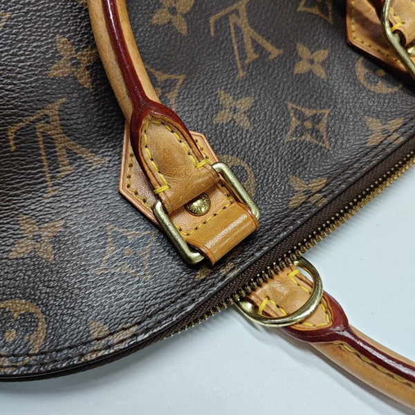 ALMA PM Monogram Coated Canvas Brown