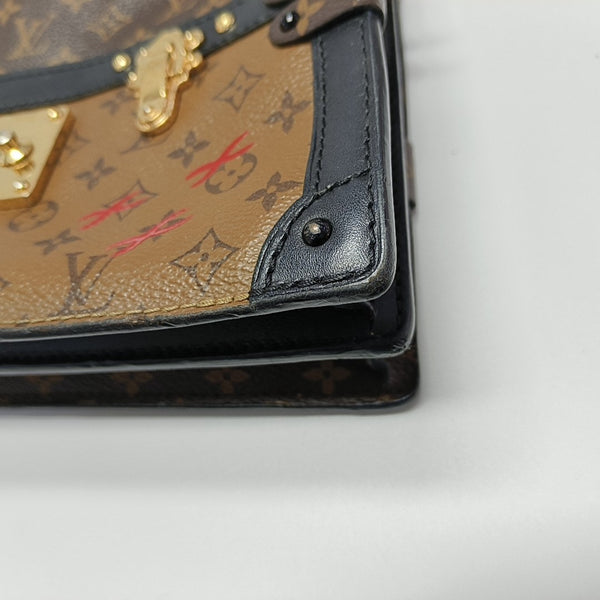 TRUNK Monogram Coated Canvas Brown