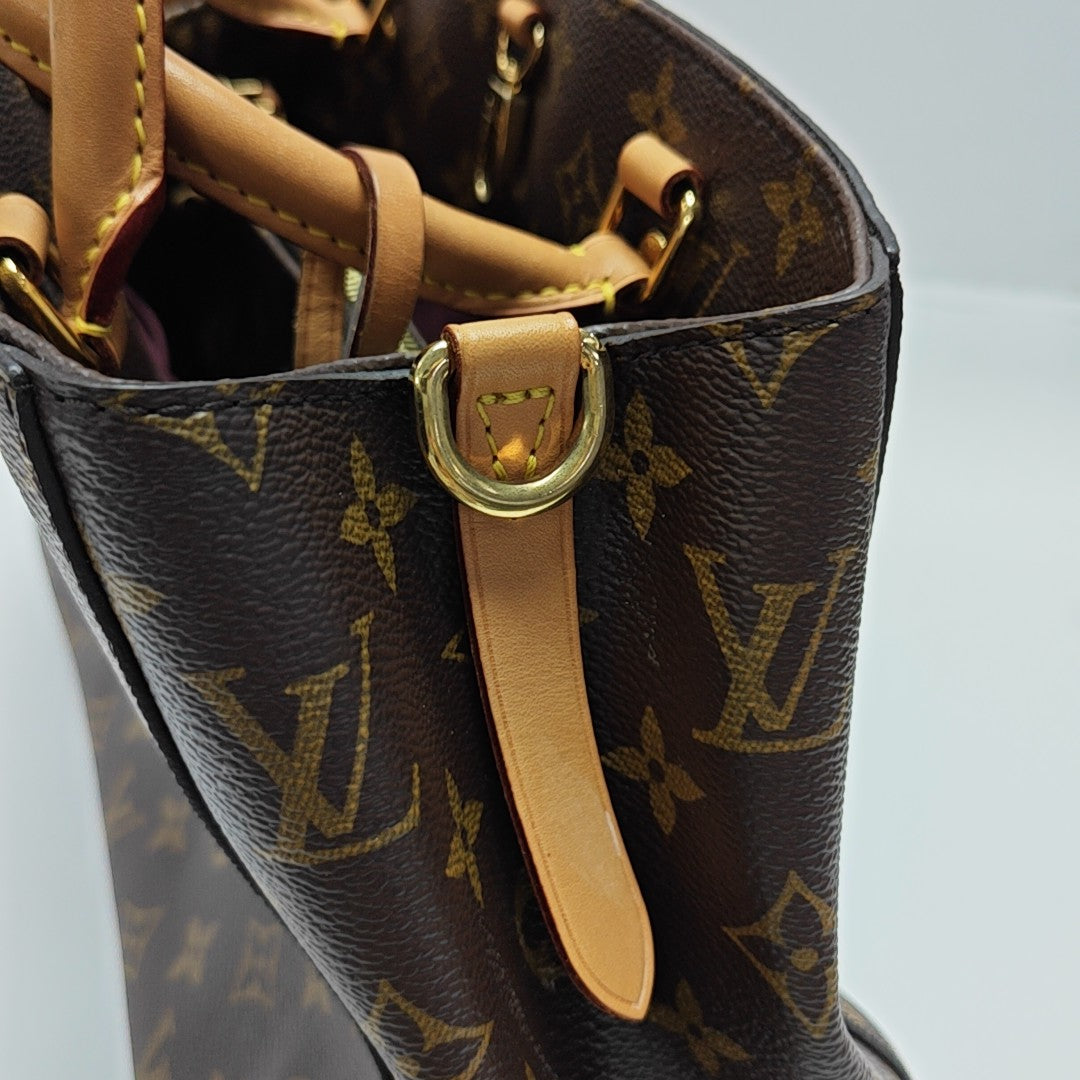 MONTAIGNE GM Monogram Coated Canvas Brown