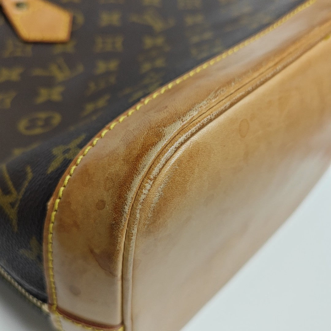 ALMA PM Monogram Coated Canvas Brown