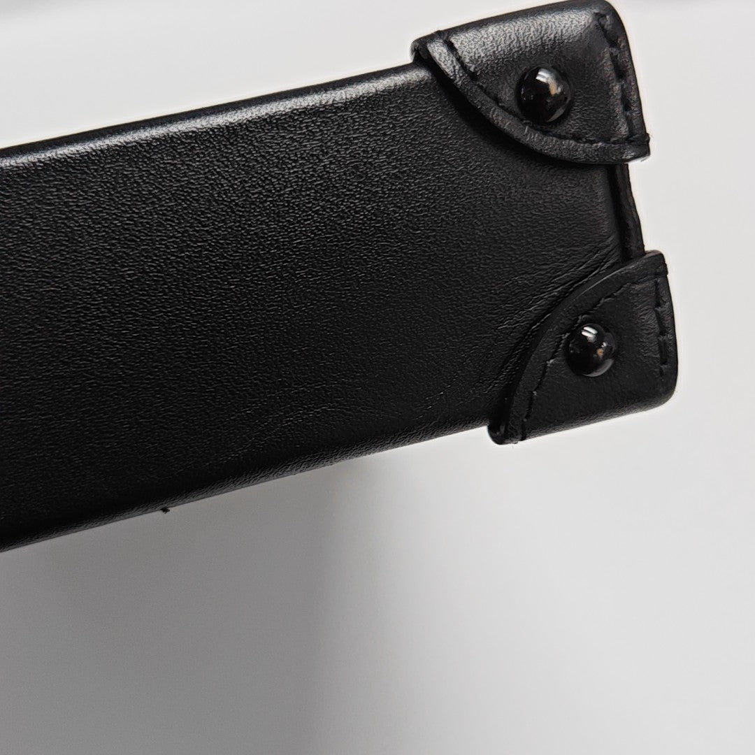 TRUNK Monogram Coated Canvas Brown