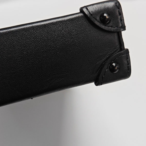 TRUNK Monogram Coated Canvas Brown