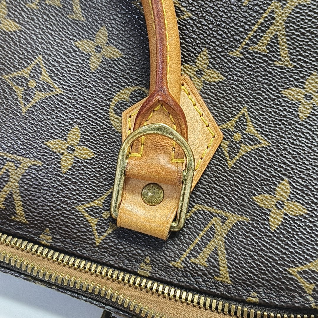 ALMA PM Monogram Coated Canvas Brown