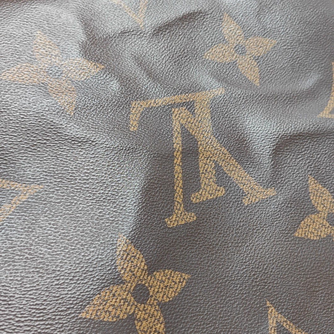 ONTHEGO GM Monogram Coated Canvas Brown