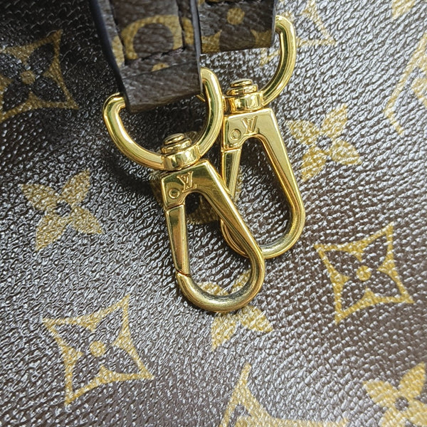 MONTAIGNE GM Monogram Coated Canvas Brown