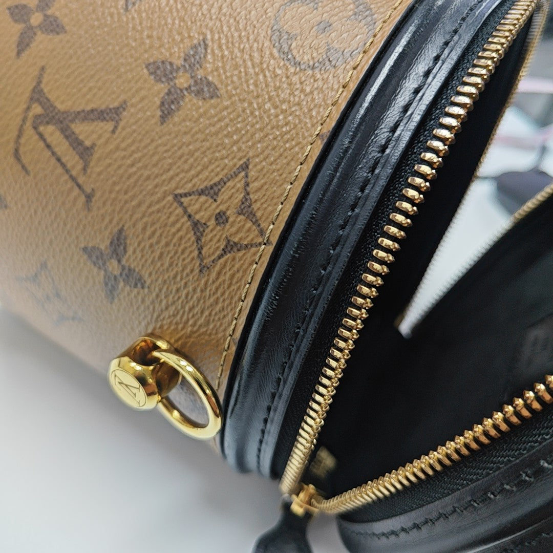 CANNES PM Monogram Coated Canvas Brown