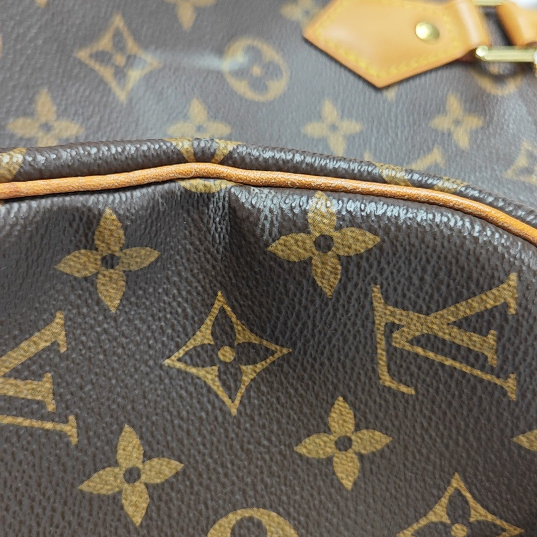 SPEEDY 25 Monogram Coated Canvas Brown