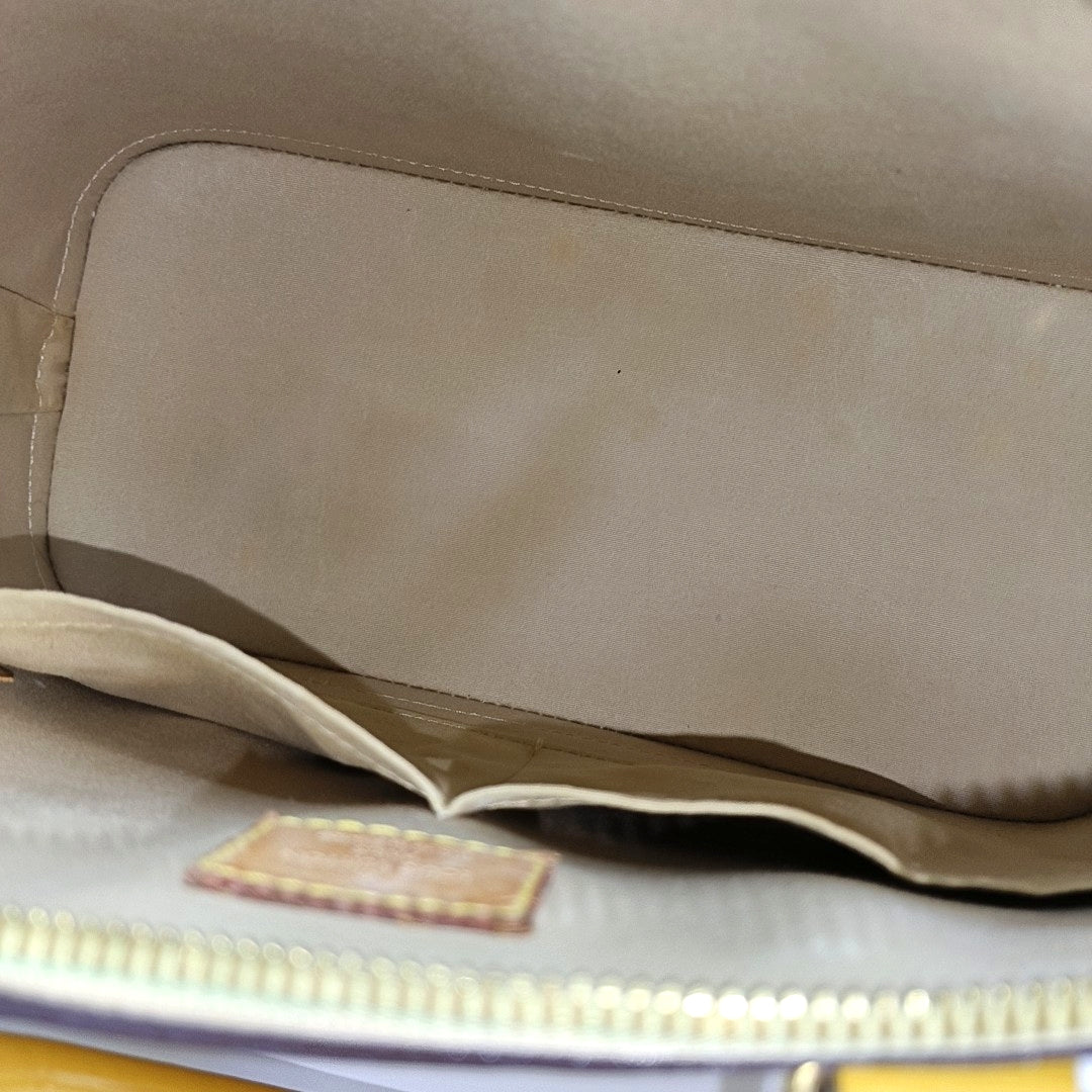 Authenticated pre-owned  Alma PM Monogram Patent Leather Yellow - Top Handle Bag at Looply