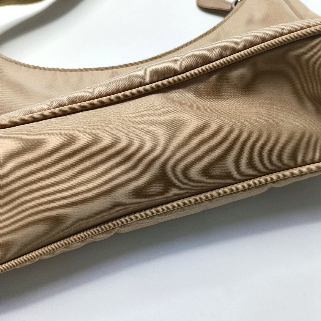 Authenticated pre-owned  Re-edition2000 Mini Nylon Beige - Top Handle Bag at Looply