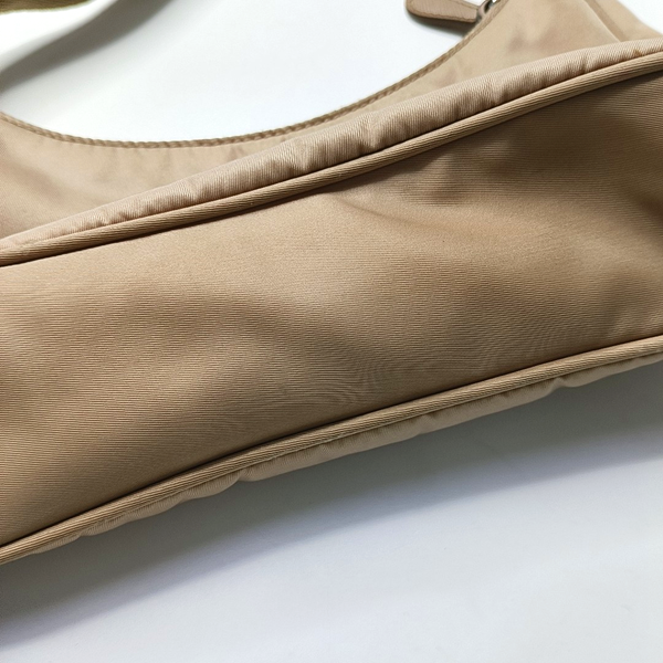 Authenticated pre-owned  Re-edition2000 Mini Nylon Beige - Top Handle Bag at Looply