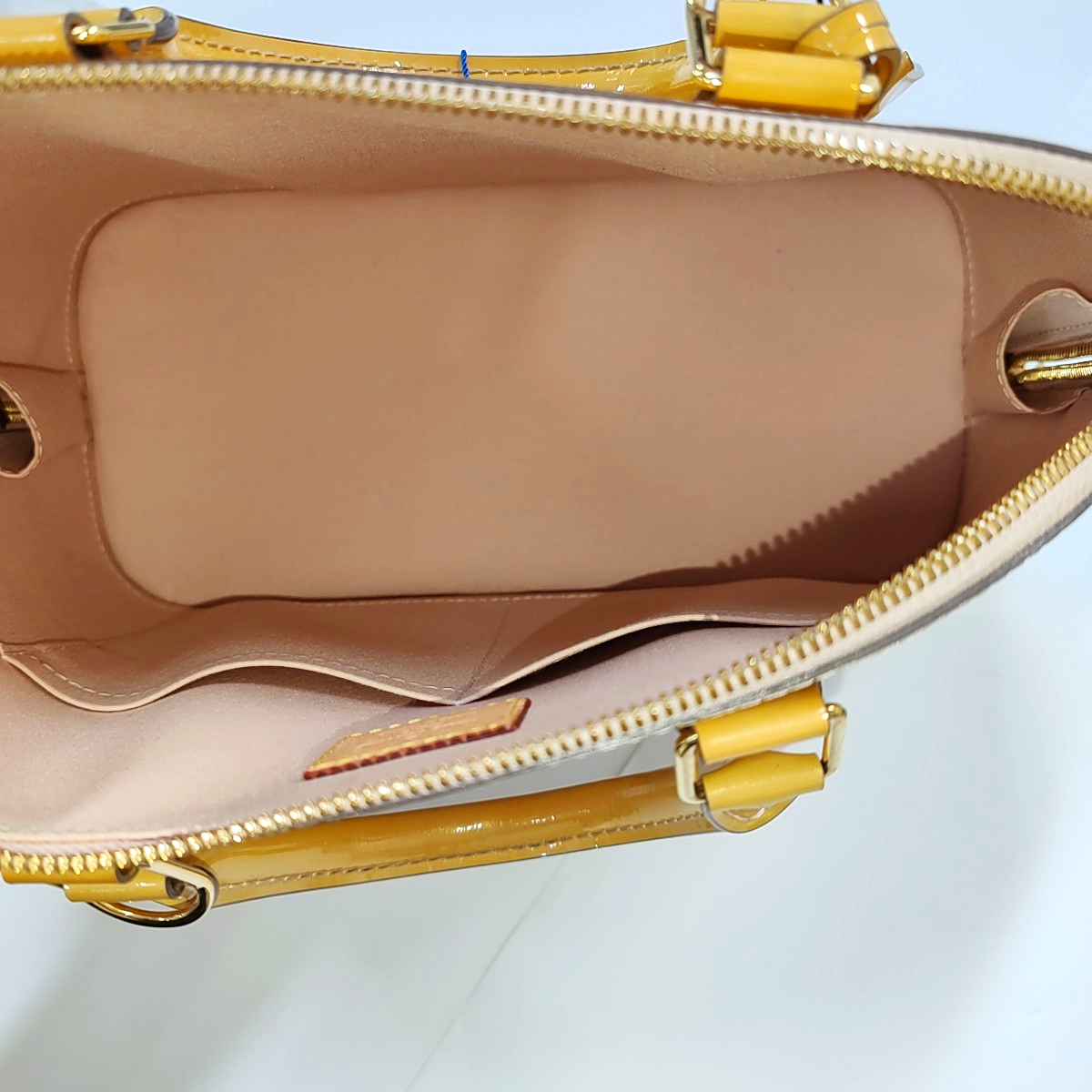 Authenticated pre-owned  Alma PM Patent Leather Yellow - Top Handle Bag at Looply