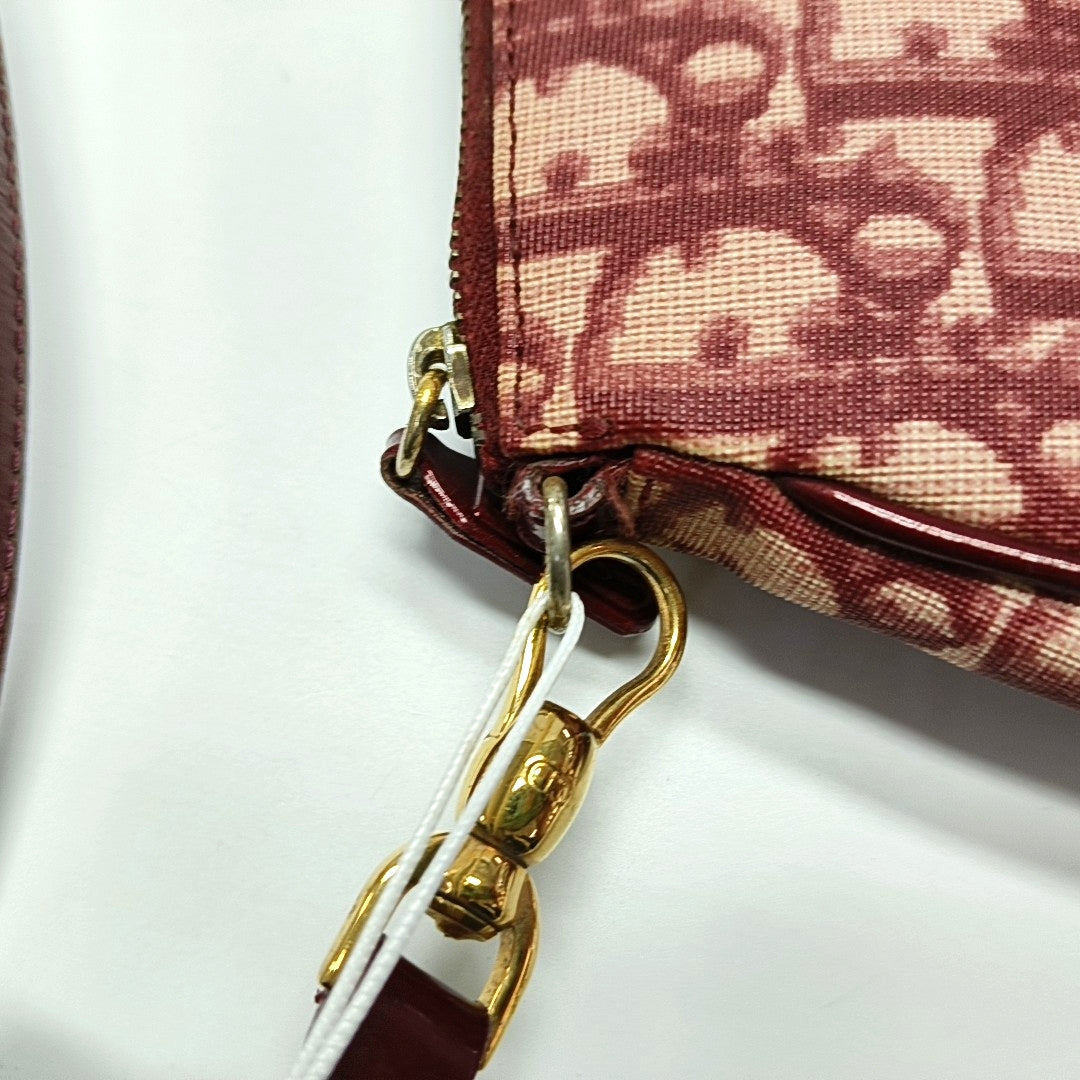 Authenticated pre-owned  Saddle Oblique Canvas Red - Top Handle Bag at Looply