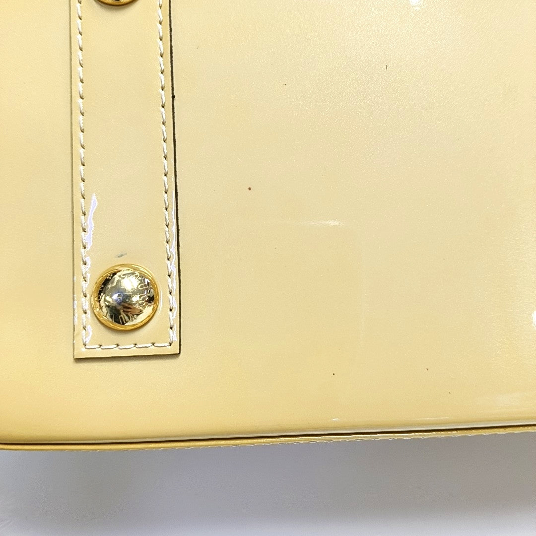 Authenticated pre-owned  Alma PM Monogram Patent Leather Yellow - Top Handle Bag at Looply