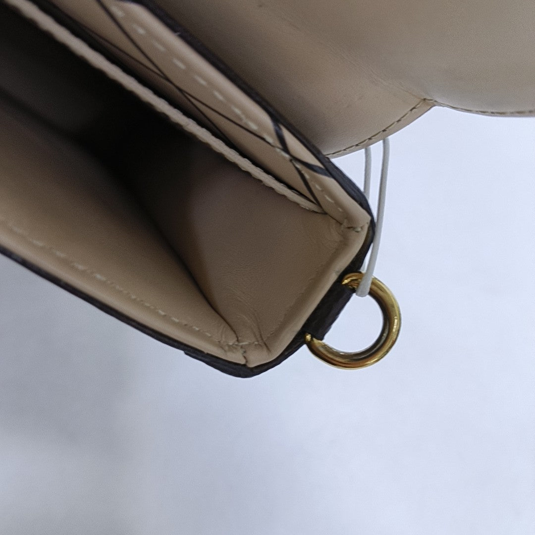 TRUNK Monogram Coated Canvas Brown