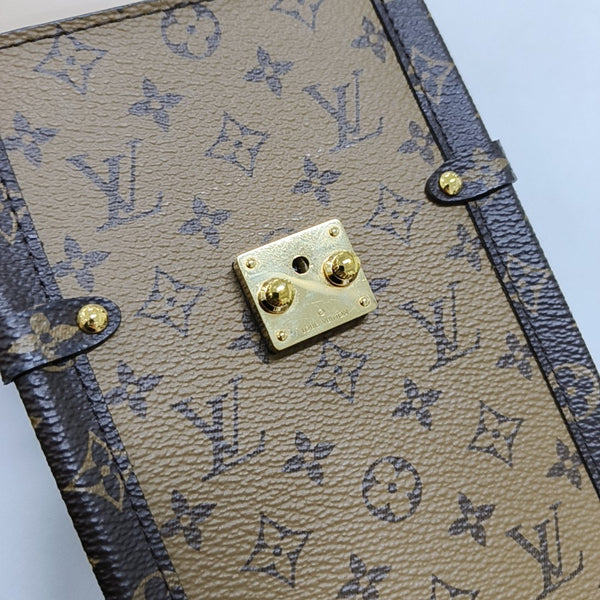 TRUNK Monogram Coated Canvas Brown