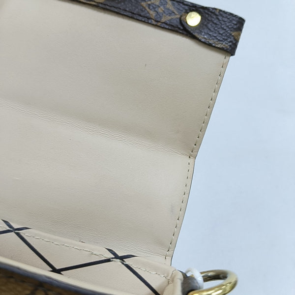 TRUNK Monogram Coated Canvas Brown
