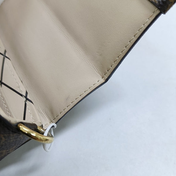 TRUNK Monogram Coated Canvas Brown