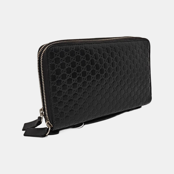 Authenticated pre-owned  Microguccissima Monogram Calfskin Black - Clutch at Looply