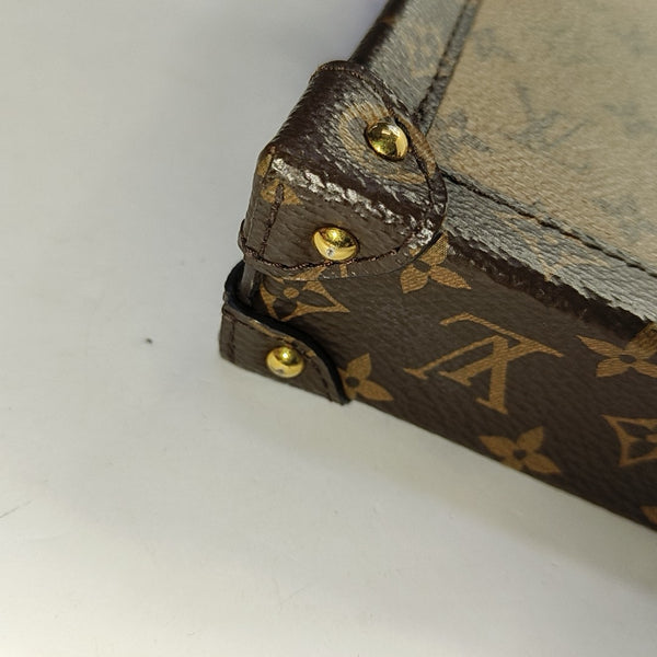 TRUNK Monogram Coated Canvas Brown