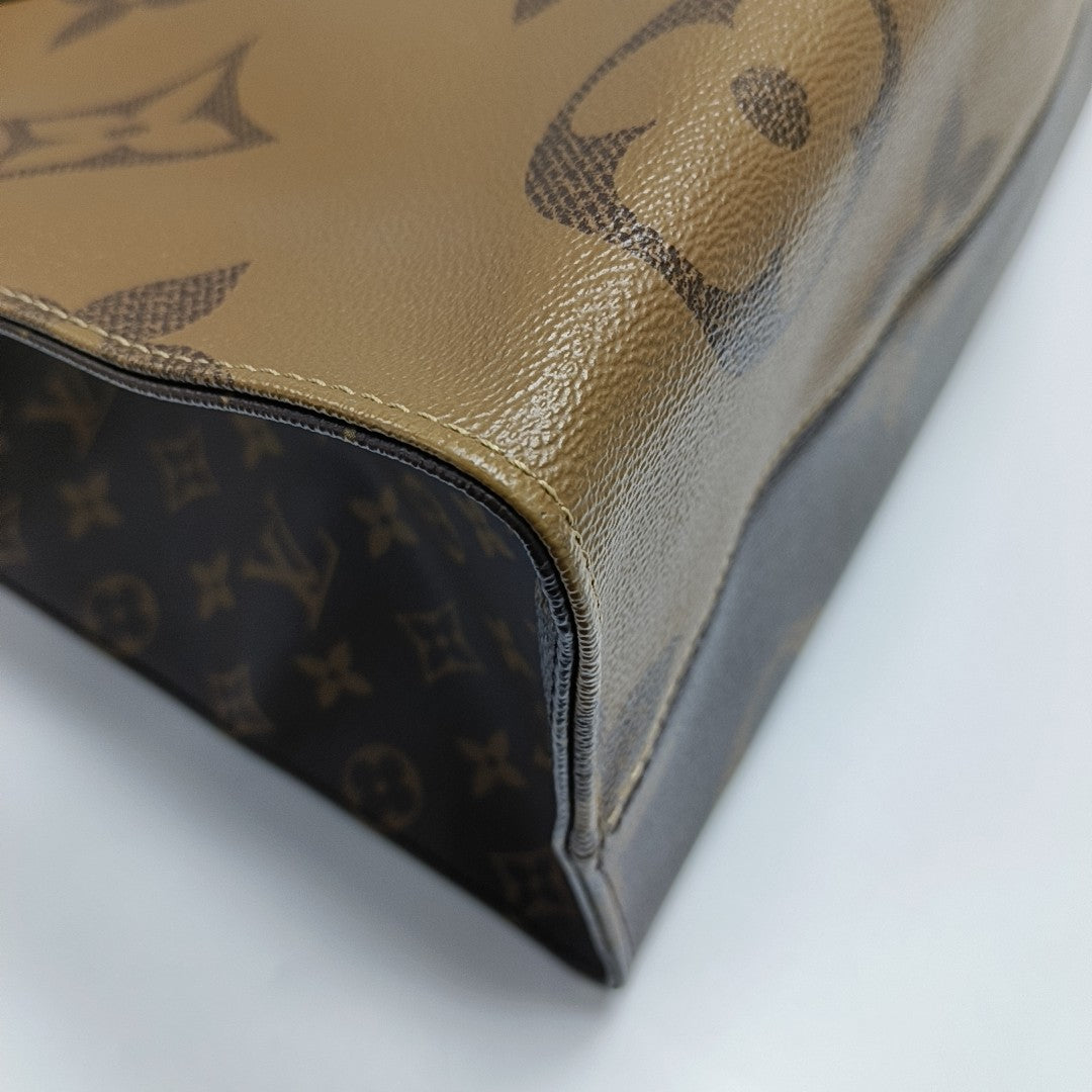 Authenticated pre-owned  Onthego GM Monogram Coated Canvas Brown - Shoulder Bag at Looply