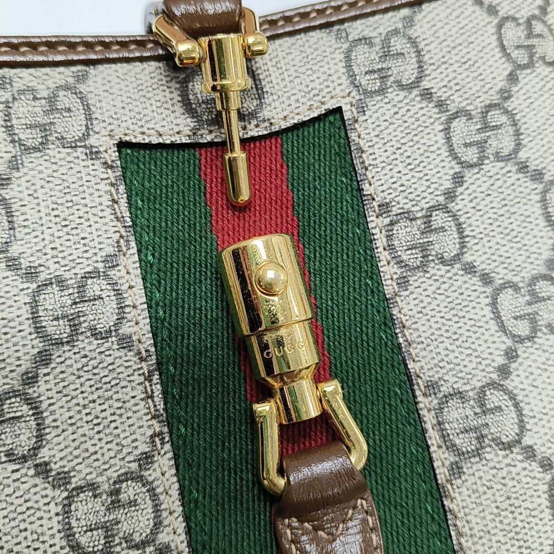 Authenticated pre-owned  Jackie 1961 Mini Monogram Coated Canvas Beige - Crossbody Bag at Looply
