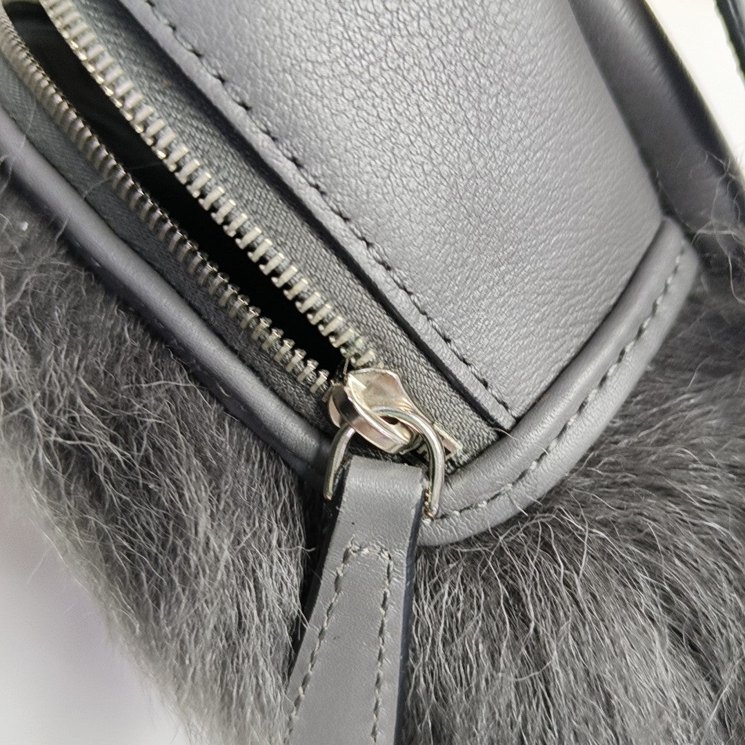 Authenticated pre-owned  Monster Calfskin Gray - Clutch at Looply