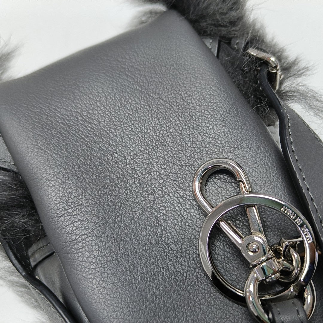 Authenticated pre-owned  Monster Calfskin Gray - Clutch at Looply