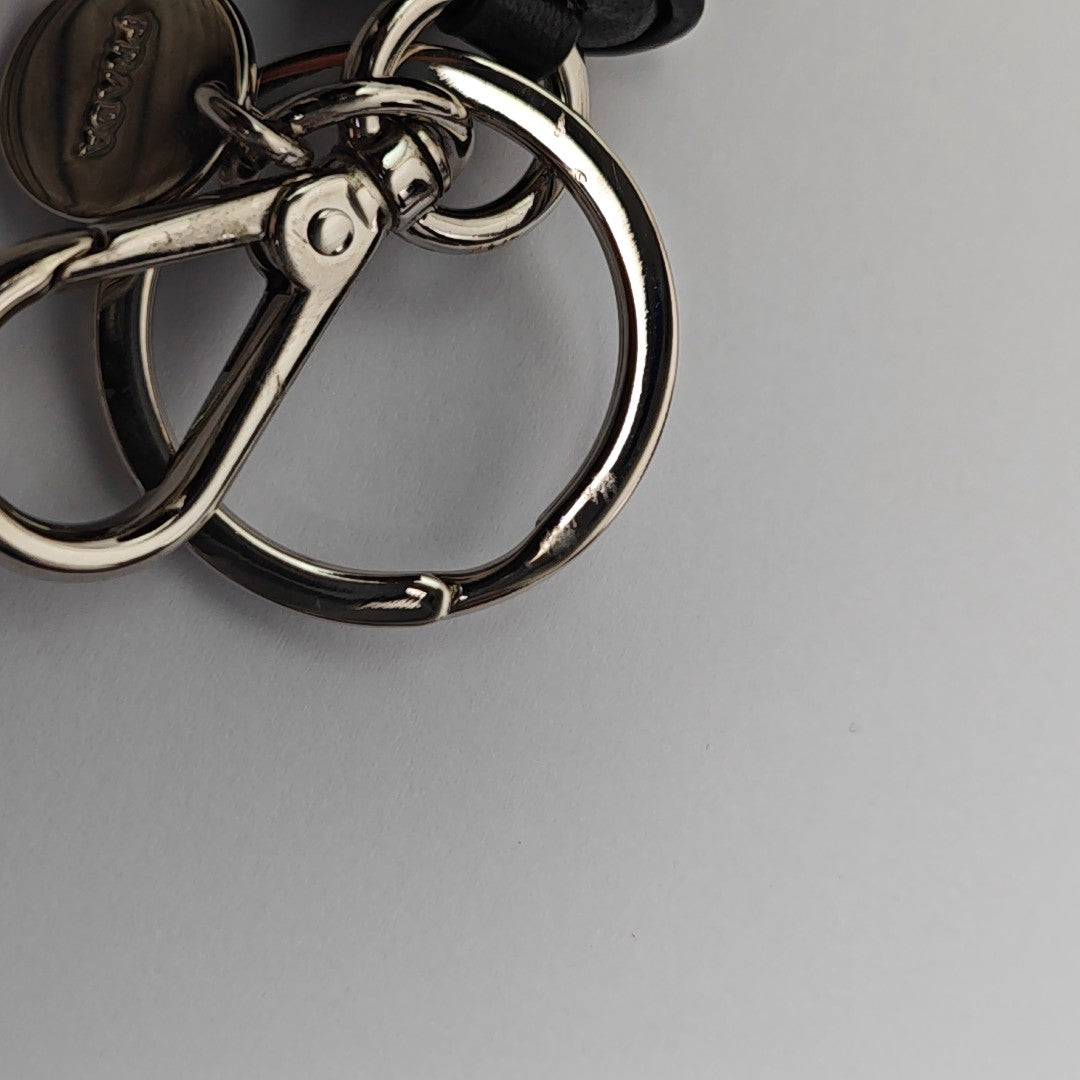 Authenticated pre-owned  Leather Black Bag Charm - Bag Charm at Looply