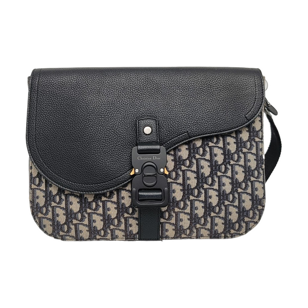 Authenticated pre-owned  Saddle Oblique Canvas Beige - Clutch at Looply