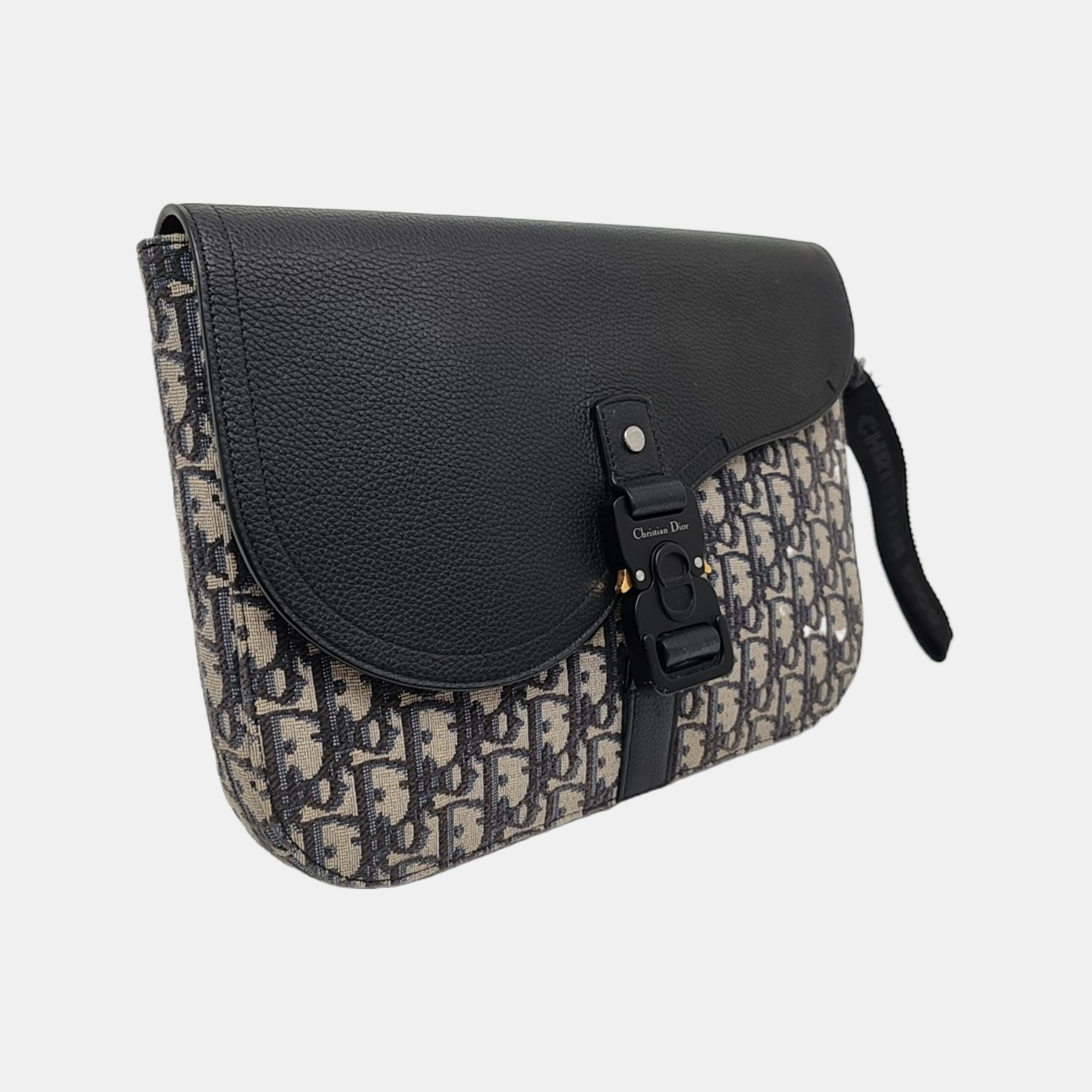 Authenticated pre-owned  Saddle Oblique Canvas Beige - Clutch at Looply