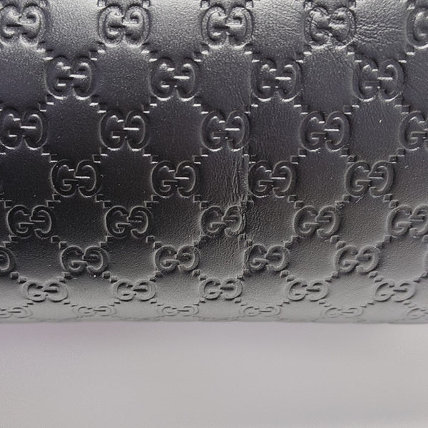 Authenticated pre-owned  Microguccissima Monogram Calfskin Black - Clutch at Looply