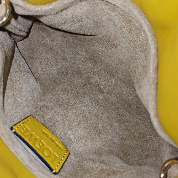 Authenticated pre-owned  Flamenco Calfskin Yellow - Clutch at Looply