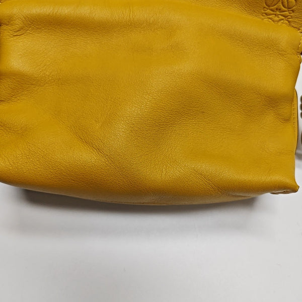 Authenticated pre-owned  Flamenco Calfskin Yellow - Clutch at Looply
