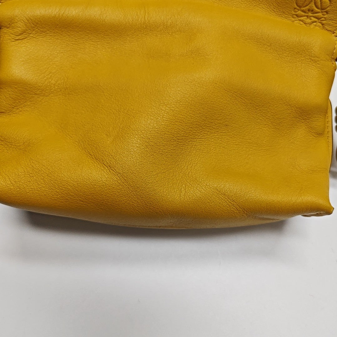 Authenticated pre-owned  Flamenco Calfskin Yellow - Clutch at Looply