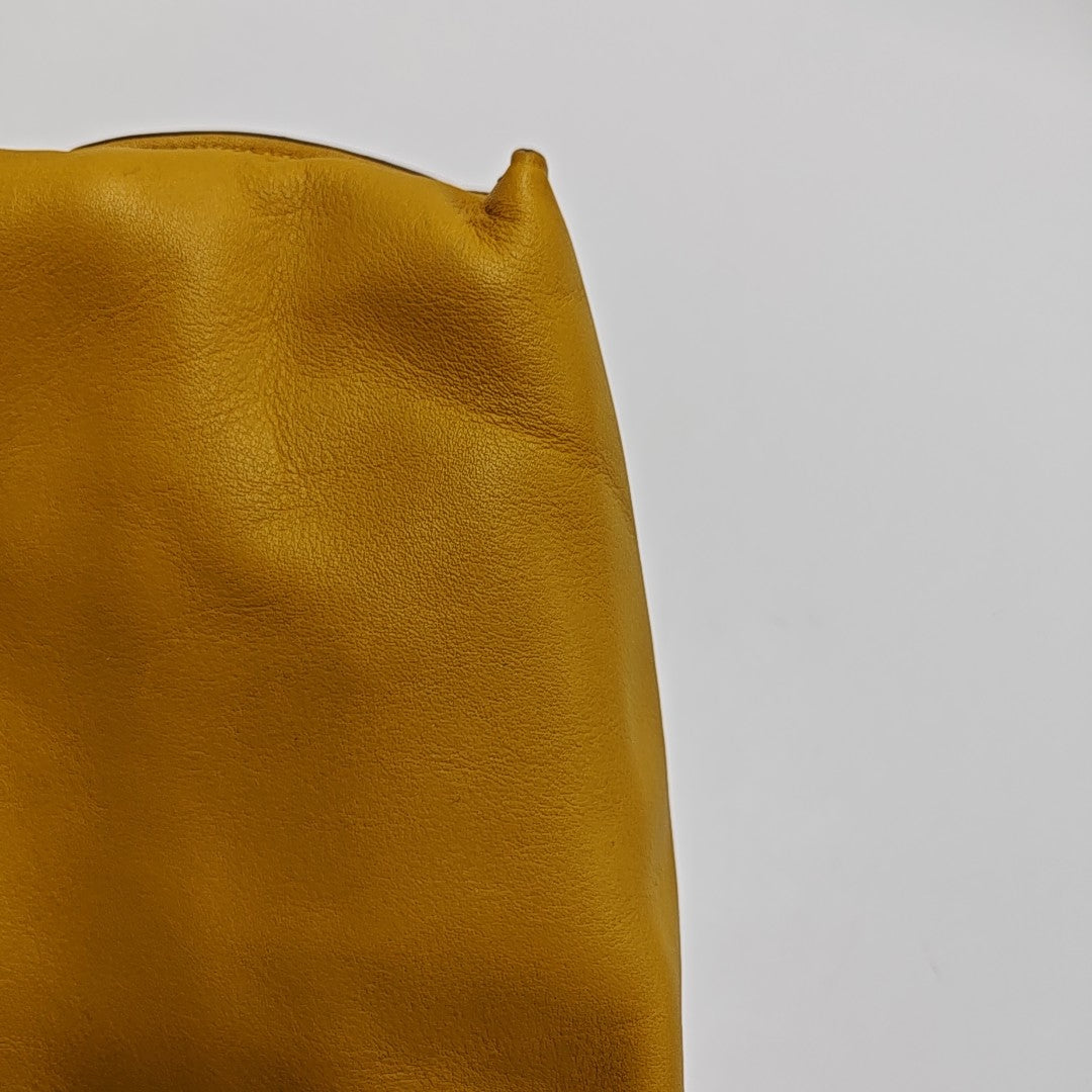 Authenticated pre-owned  Flamenco Calfskin Yellow - Clutch at Looply