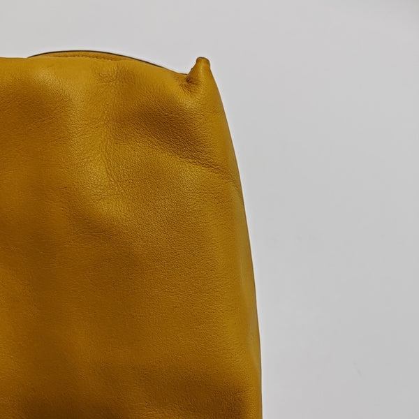 Authenticated pre-owned  Flamenco Calfskin Yellow - Clutch at Looply