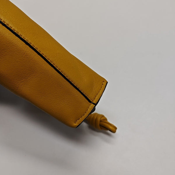 Authenticated pre-owned  Flamenco Calfskin Yellow - Clutch at Looply