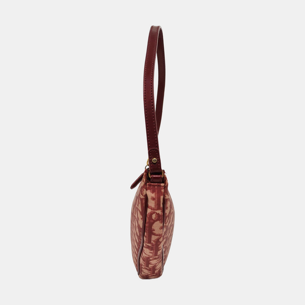 Authenticated pre-owned  Saddle Oblique Canvas Red - Top Handle Bag at Looply