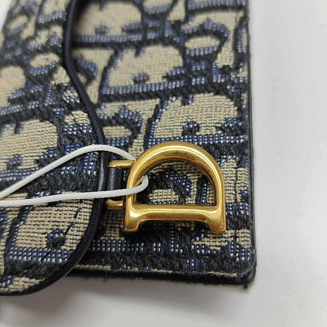 Authenticated pre-owned  Saddle Oblique Fabric Blue Card Holder - Card Holder at Looply