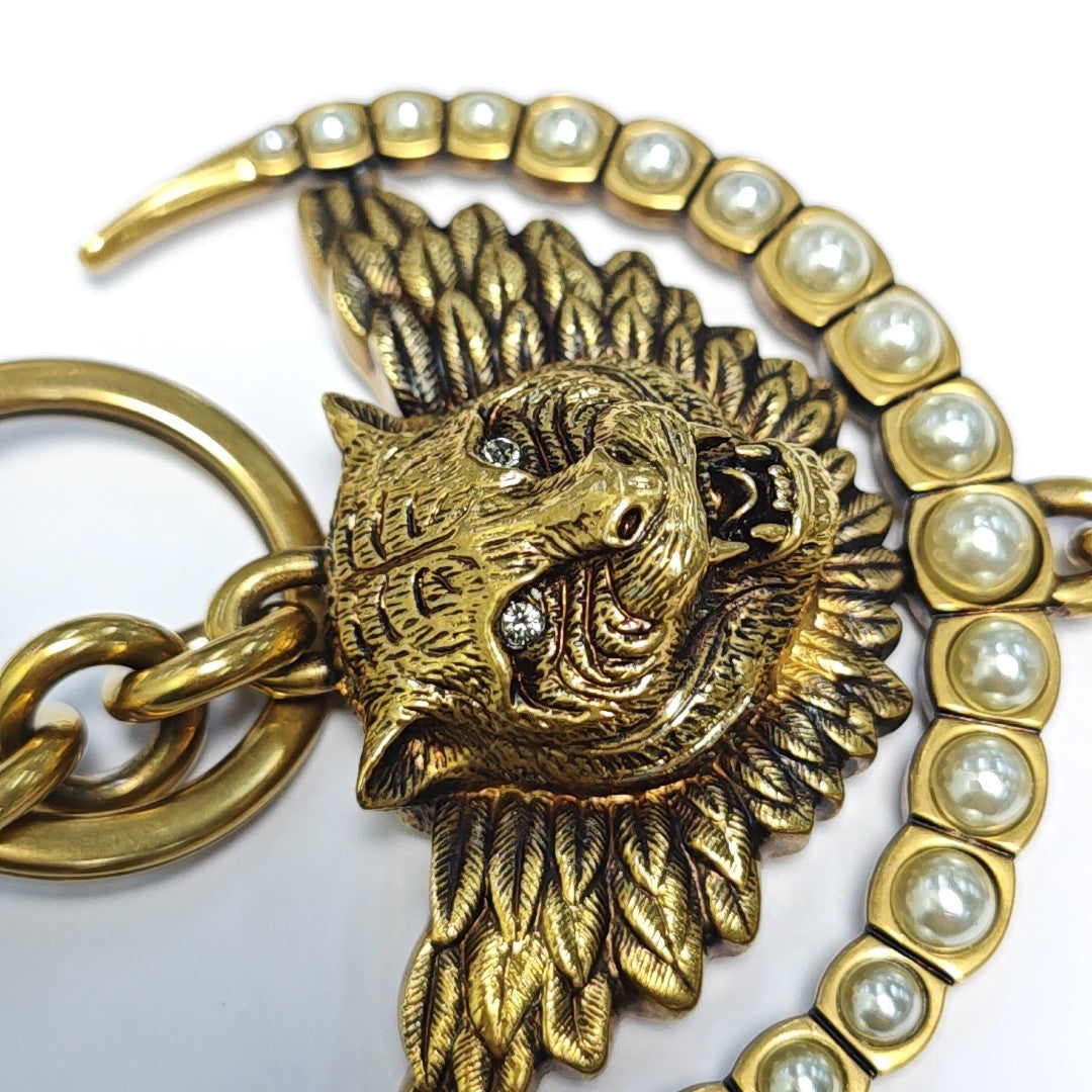 Authenticated pre-owned  Gold-tone Metal Bag Charm - Bag Charm at Looply