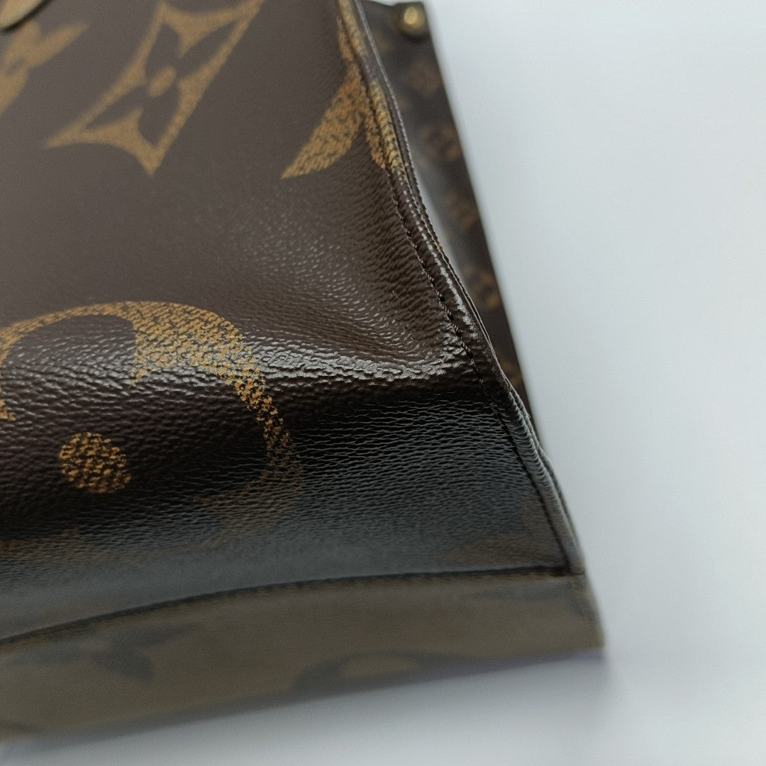 Authenticated pre-owned  Onthego GM Monogram Coated Canvas Brown - Shoulder Bag at Looply