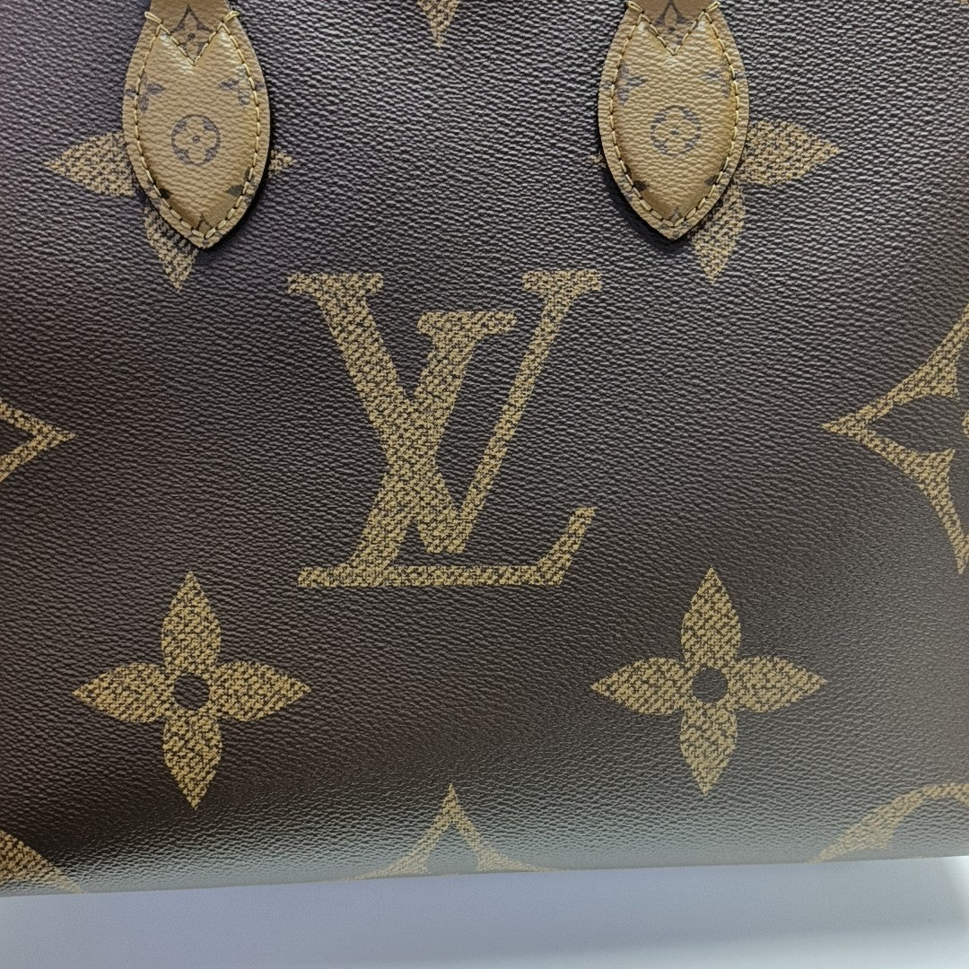 ONTHEGO MM Monogram Coated Canvas Brown