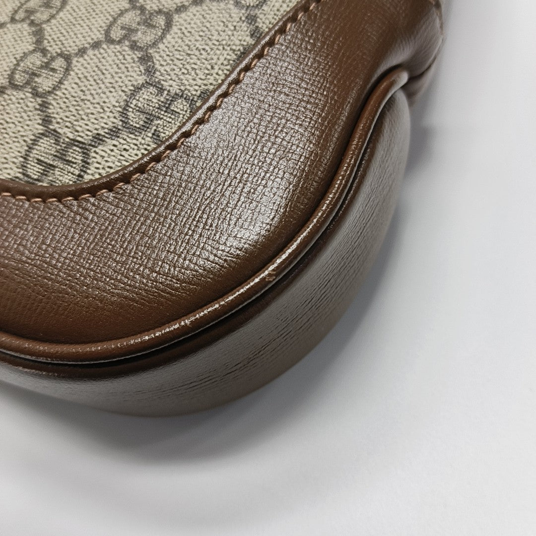 Authenticated pre-owned  Jackie 1961 Small Monogram Coated Canvas Beige - Top Handle Bag at Looply