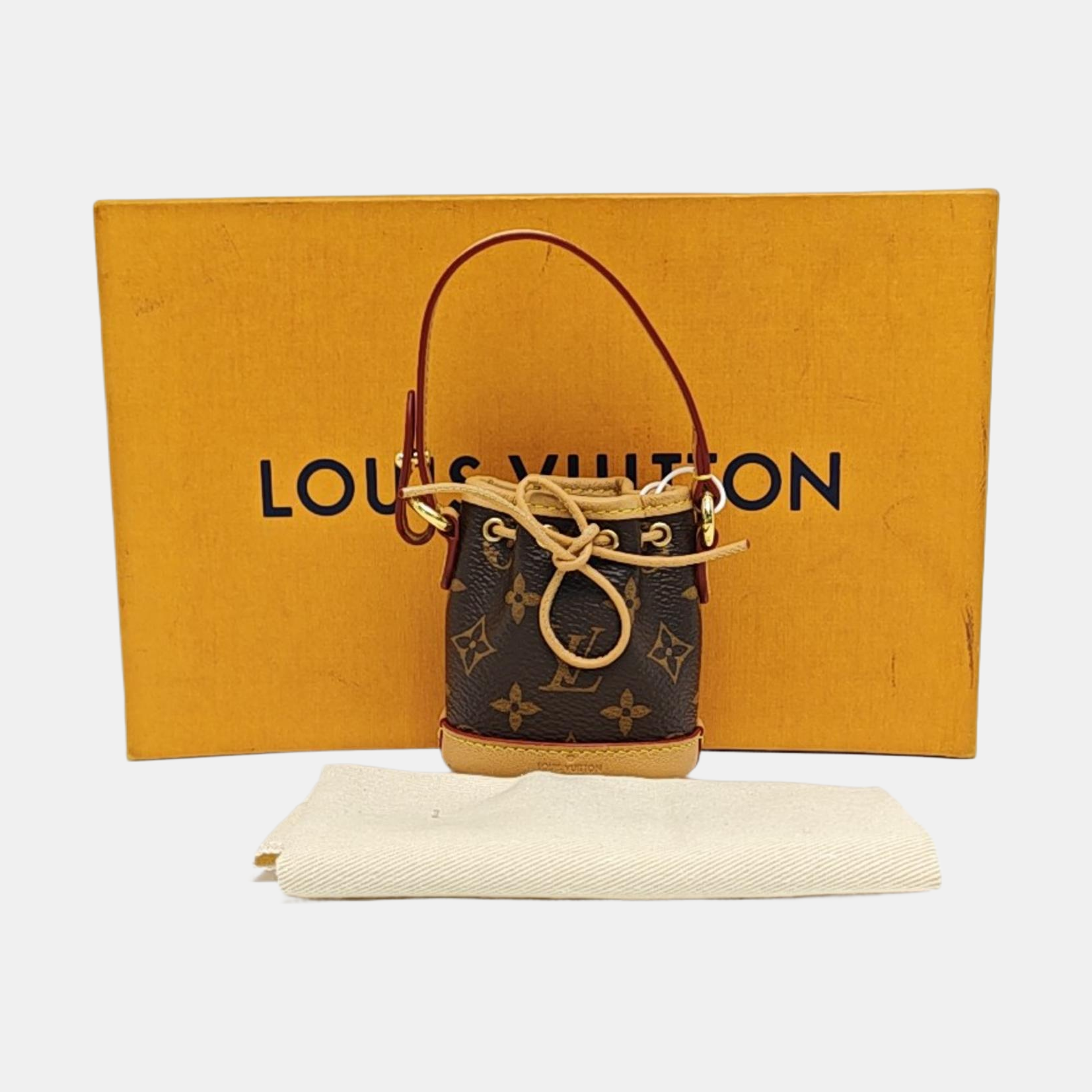 Authenticated pre-owned  Noé Monogram Coated Canvas Brown - Top Handle Bag at Looply