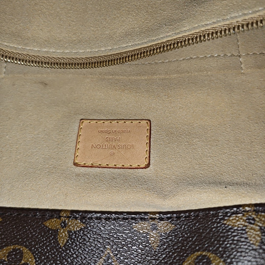 Authenticated pre-owned  Artsy MM Monogram Coated Canvas Brown - Top Handle Bag at Looply