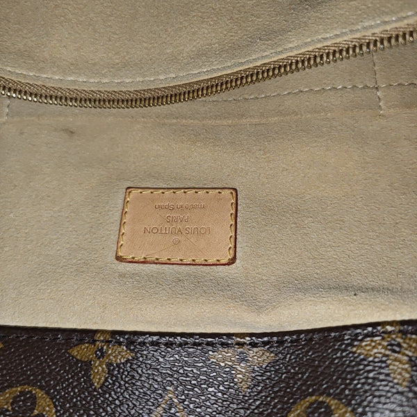 Authenticated pre-owned  Artsy MM Monogram Coated Canvas Brown - Top Handle Bag at Looply