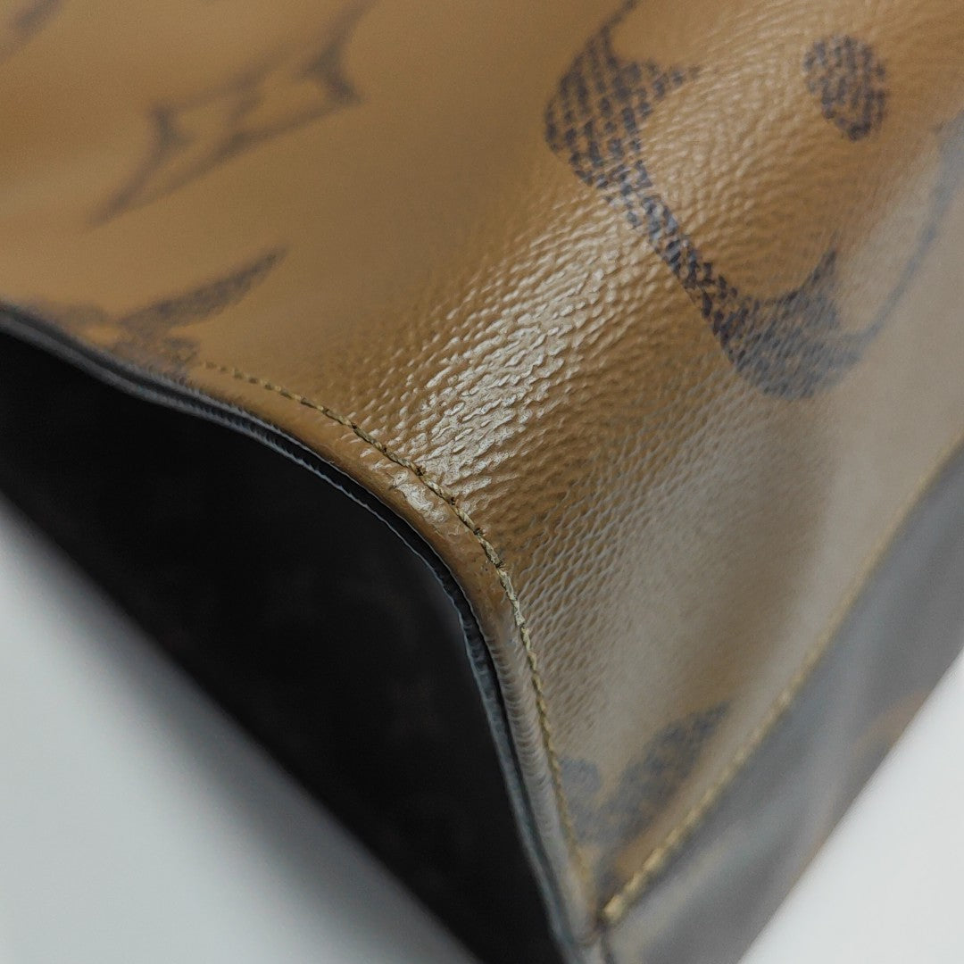 Authenticated pre-owned  Onthego GM Monogram Coated Canvas Brown - Shoulder Bag at Looply