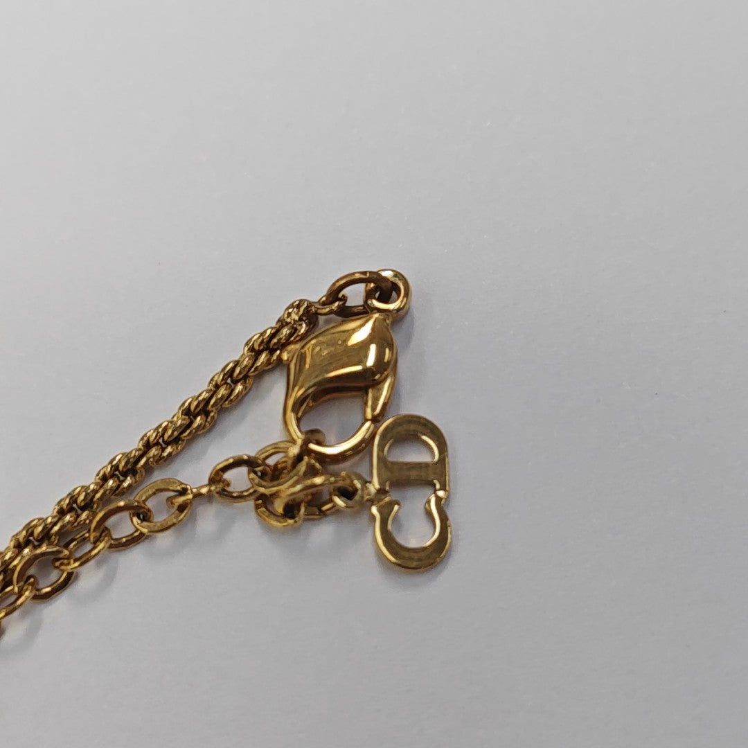 Authenticated pre-owned  Twist Round Gold-Tone Metal Necklace - Necklace at Looply