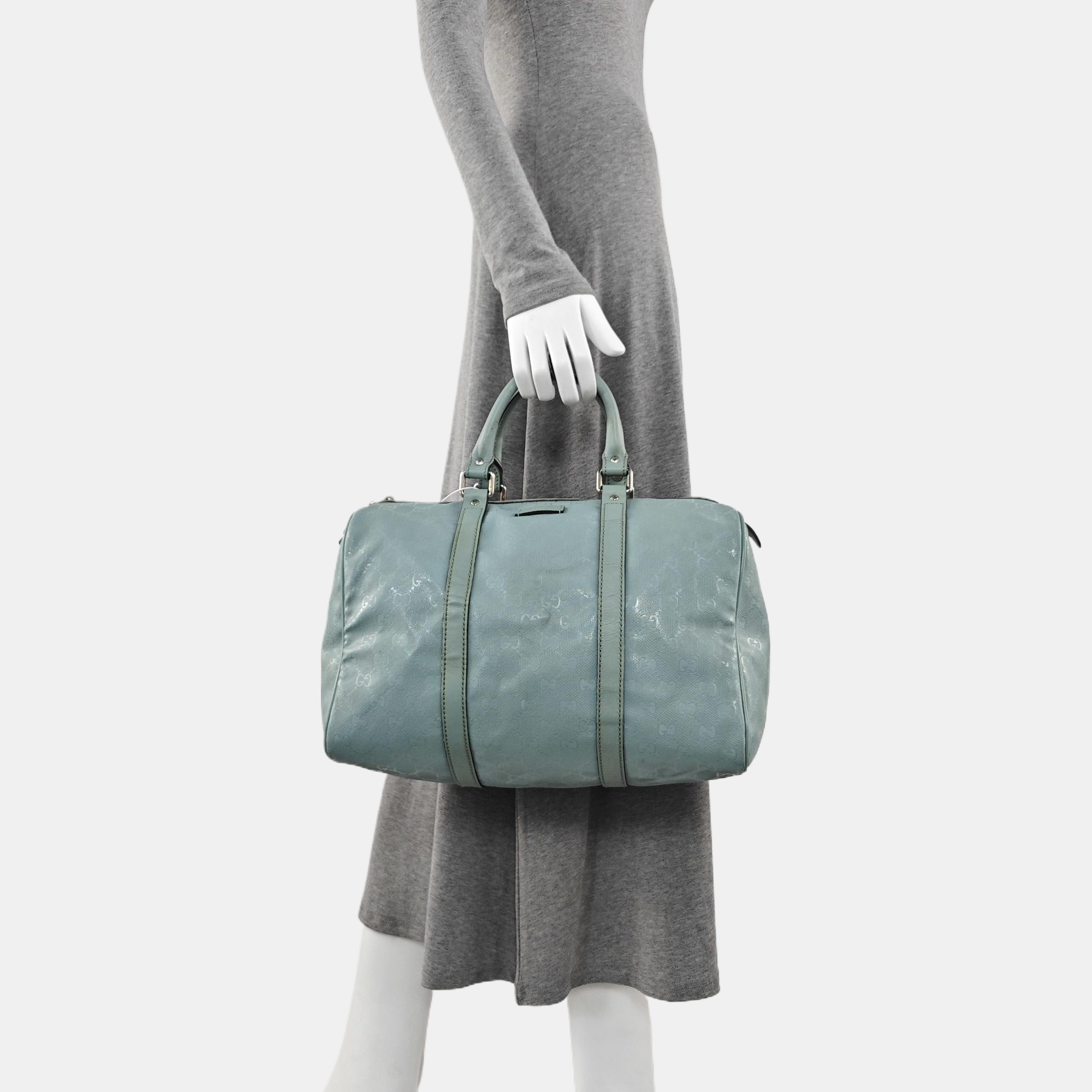 Authenticated pre-owned  Joy Medium Monogram Coated Canvas Blue - Top Handle Bag at Looply